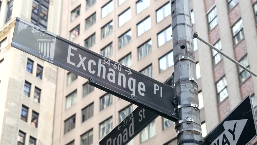 New York City, United States. Lower Manhattan Downtown Financial District. American Wall street. Exchange and Broad corner road traffic sign. Stock Exchange, USA Stock Market. Crossroad intersection.