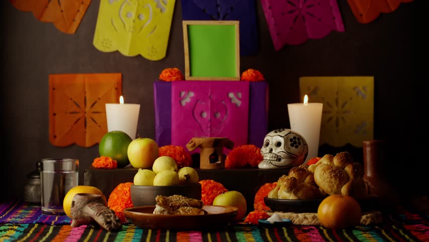 A Mexican woman is placing a black plate with red rice in a Day of the Dead offering, green screen