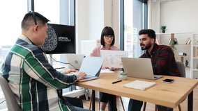 Office colleagues collaborating on artificial intelligence project. Team members analyzing data, discussing findings, using laptops. Modern office environment with natural light. - Powered by Shutterstock - Get 15% off with code: PIKWIZARD15