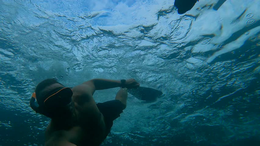 Man takes selfie with turtle underwater. Diver takes photo with big turtle during underwater diving, underwater shooting
