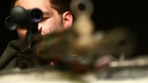 Sniper aiming out of window Video Stok