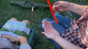 A young father and his son enjoy quality time together, fishing at a pond. The father teaches his son the basics of fishing, creating cherished memories during their outdoor family bonding experience - Powered by Shutterstock - Get 15% off with code: PIKWIZARD15