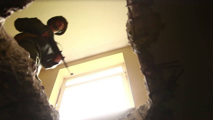 Soldiers jumping over hole