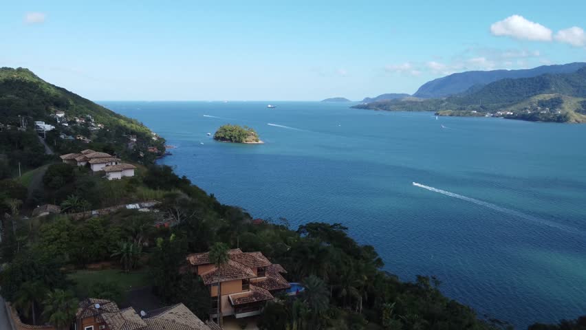 Aerial view of beautiful Bela Island with lush greenery and tranquil ocean, Sao Paulo, Brazil.