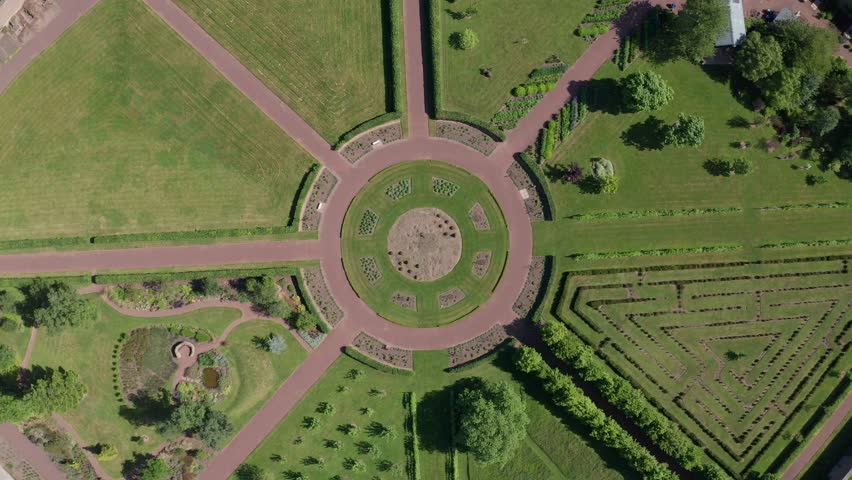 Aerial view of the beautiful Amisfield Walled Garden featuring lush greenery and circular design pathways, Haddington, United Kingdom.
