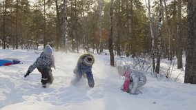 Full shot of four little boys and girls in warm clothes playing in winter forest, throwing snow and having fun during holidays on frosty day - Powered by Shutterstock - Get 15% off with code: PIKWIZARD15