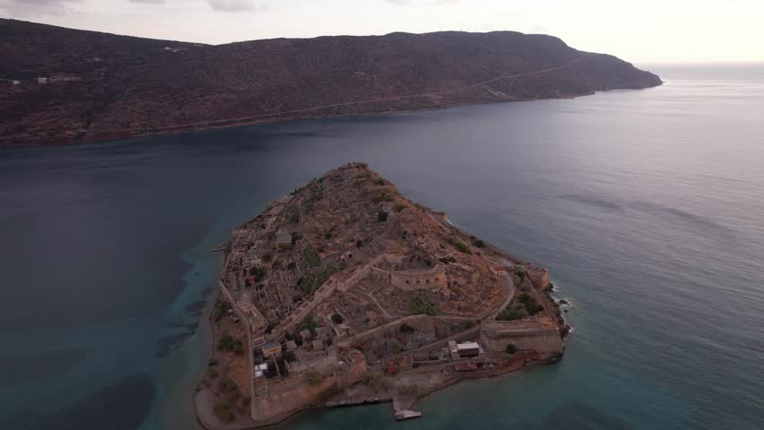 Explore the stunning beauty of Crete, Greece, with views of historical landscapes and tranquil waters at sunset