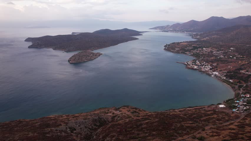 Discover the serene beauty of Crete, Greece, with its breathtaking coastline and tranquil waters at sunset