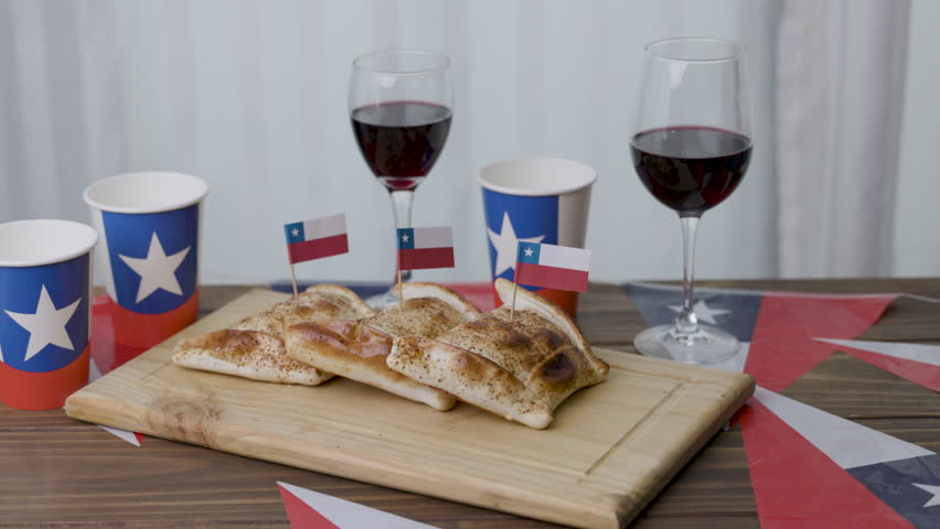 Fiestas Patrias Chile taking out a wine glass Empanada and chilean flags