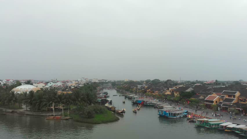 Aerial view of vibrant Hoi An with traditional basket boats on the river, Cam Thanh, Vietnam.