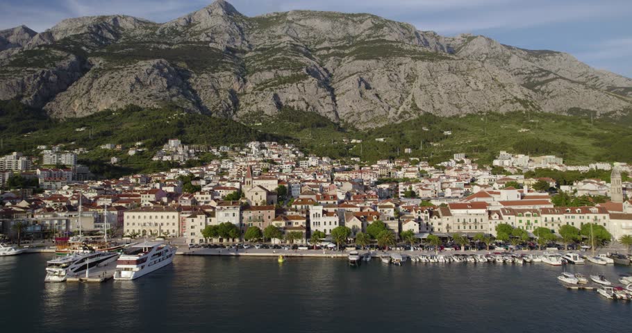 Ferry Terminal On Luka Makarska In Croatia. Biokovo Mountains And Makarska Town In Background. drone shot
