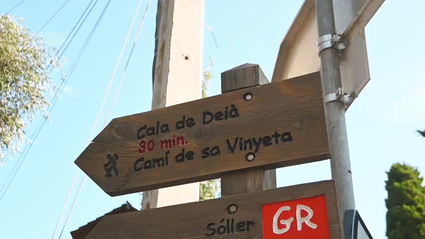 Hiking signs in the village of Deia