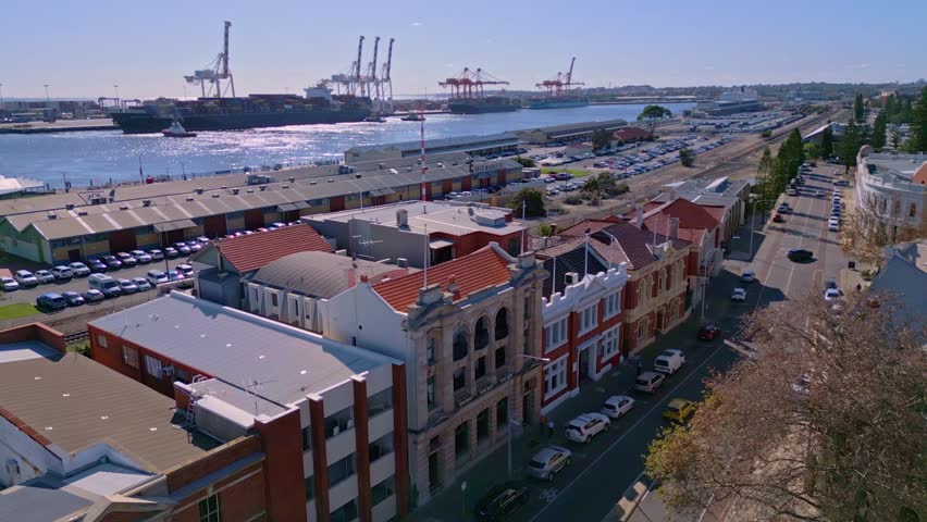 Old buildings on Phillimore Street in Fremantle with industrial port in background, Perth, Western Australia