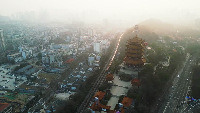 Aerial view of beautiful bustling cityscape with modern skyscrapers and busy roads, Wuhan, China.