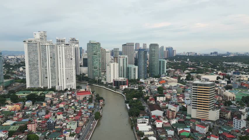 Flying forwards above the Metro Manila the capital of Philippines. Aerial footage.