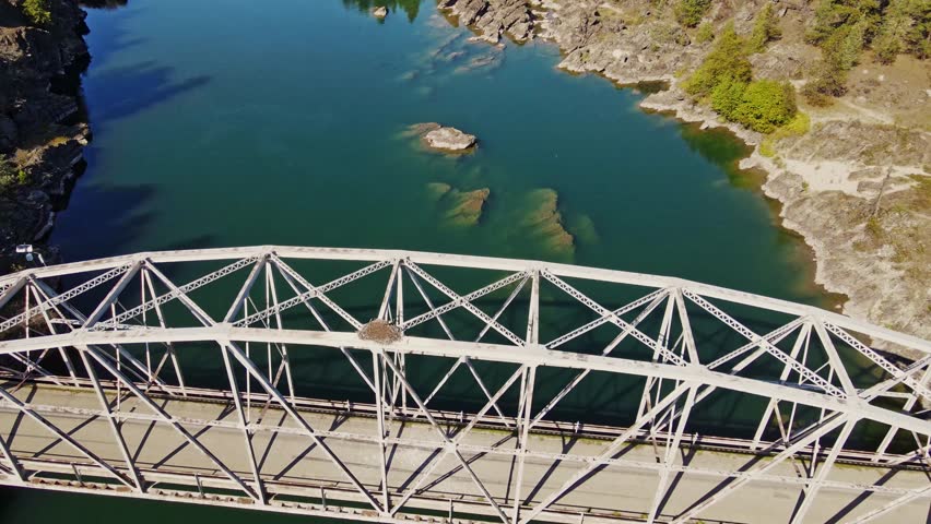 A bridge located in the beautiful state of Montana along the Clark Fork River.