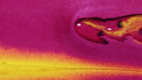 Vertical video. Paint drip. Glitter gel fluid. Defocused bright magenta pink golden yellow color shimmering sequin particles texture ink spill flow motion abstract art background. - Powered by Shutterstock - Get 15% off with code: PIKWIZARD15