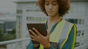 Animation of financial data processing over biracial businesswoman using tablet. Global business, finances, computing and digital interface concept digitally generated video. - Powered by Shutterstock - Get 15% off with code: PIKWIZARD15