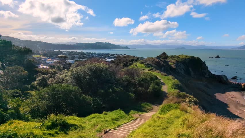 Scenic panoramic landscape view overlooking Wellington harbour ocean and islands from top of rugged hills and cliffs in capital city of New Zealand Aotearoa
