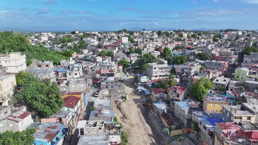 Favela in Santo Domingo, aerial establisher on a sunny day, poverty neighborhood