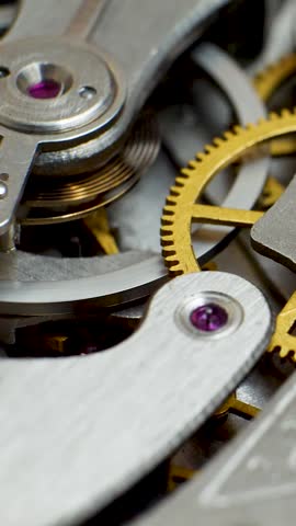The old clock mechanism in the mechanic watch works. It is a successful business or teamwork. The gears and springs in mechanical watches help to synchronise movement