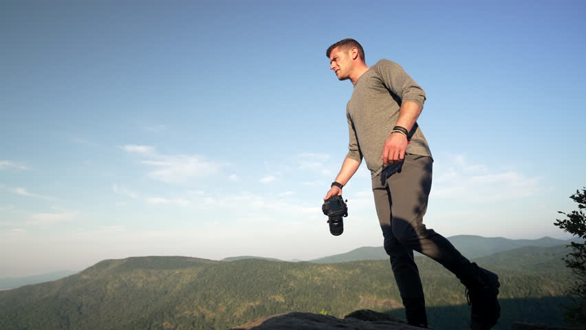 Man Standing Top Of Mountain Proud HIker Summer Adventure Photographer