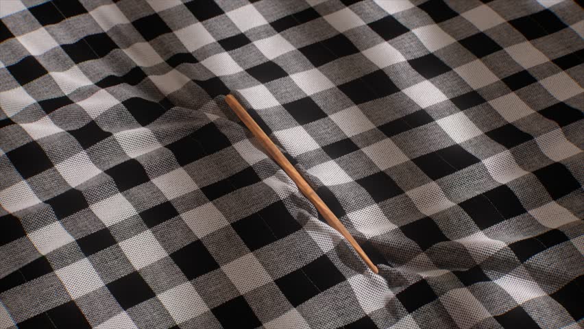 Black and white checkered fabric with a textured surface, flowing gently to reveal folds and depth. 3D Illustration