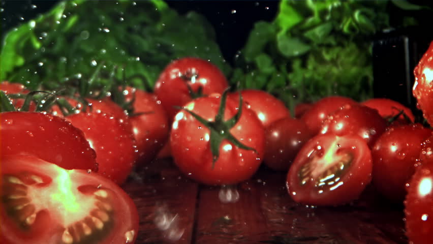 Fresh tomatoes with a splash of water. Filmed on a high-speed camera at 1000 fps. High quality FullHD footage - Powered by Shutterstock - Get 15% off with code: PIKWIZARD15