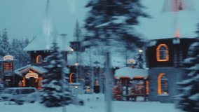 Driving past Santa Claus' Village in winter in Rovaniemi, Lapland, graded, snowy - Powered by Shutterstock - Get 15% off with code: PIKWIZARD15