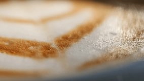 A closeup view showcasing the intricate and beautiful latte art on a coffee surface - Powered by Shutterstock - Get 15% off with code: PIKWIZARD15