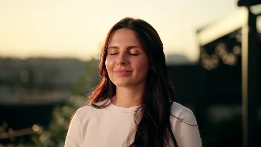 Portrait of Young Beautiful Woman with Long Hair Exhaling Fresh Air, Taking Deep Breath and Reducing Stress