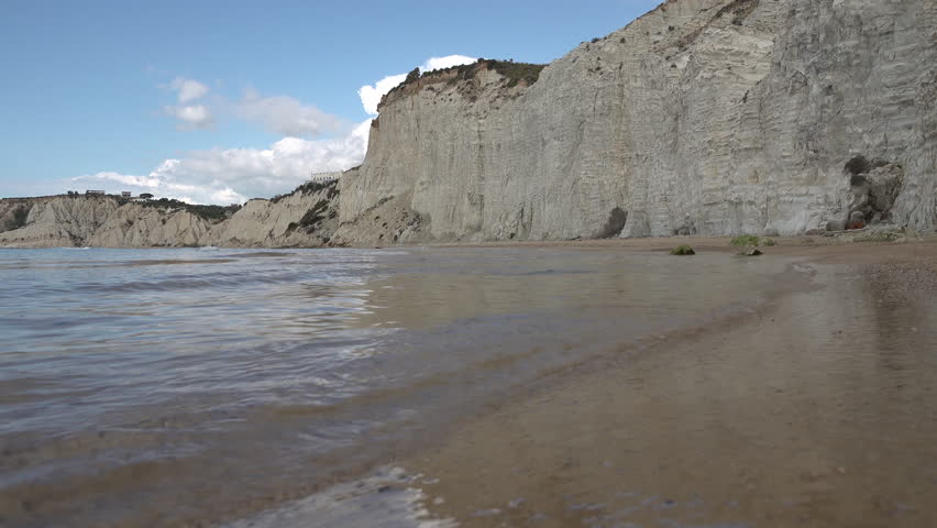 Gentle waves on beautiful secluded beach at the Scala dei Turchi, natural landscapes along beautiful coastline of Southern Sicily Italy
