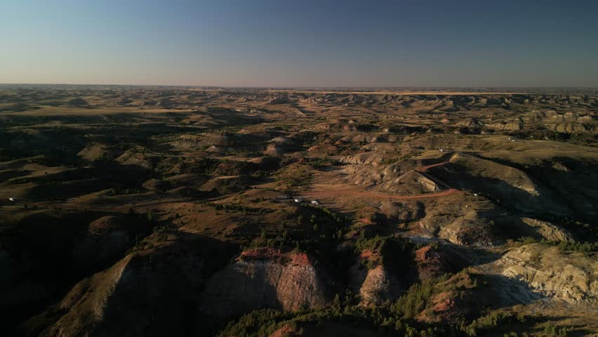 Aerial of RVs camping at sunset in Medora North Dakota badlands