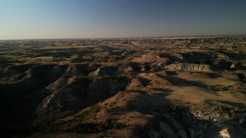 Aerial of RVs camping in National Grasslands in North Dakota near Medora at sunset