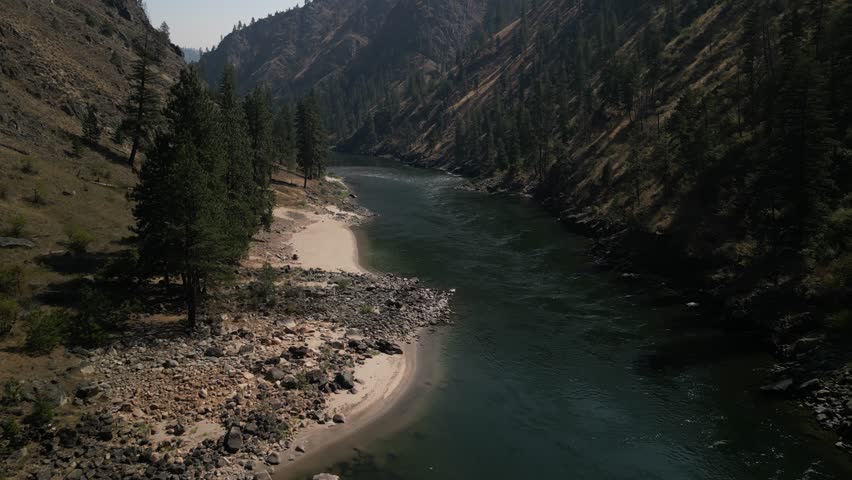 Low aerial above white sandy beaches on Salmon River in Riggins Idaho