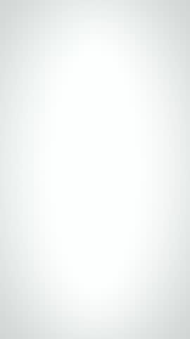 A United States quarter dollar bounces on a perfectly white surface. Slow Motion.