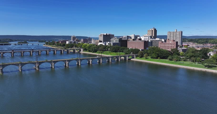 Late summer, early fall aerial, drone, video of the Harrisburg Pennsylvania skyline and the Susquehanna River.  September 2024.