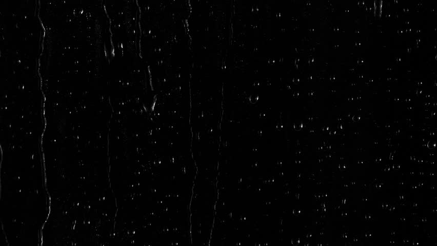 Closeup water rainfall, rain drops falling on window glass over black background