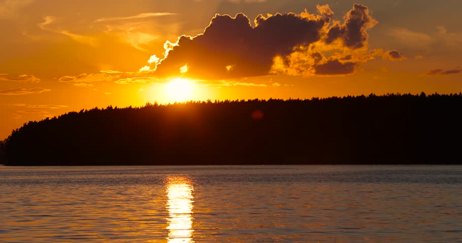 beautiful orange sky during sunset on the lake, beautiful colorful orange sky reflected in the lake water during sunset