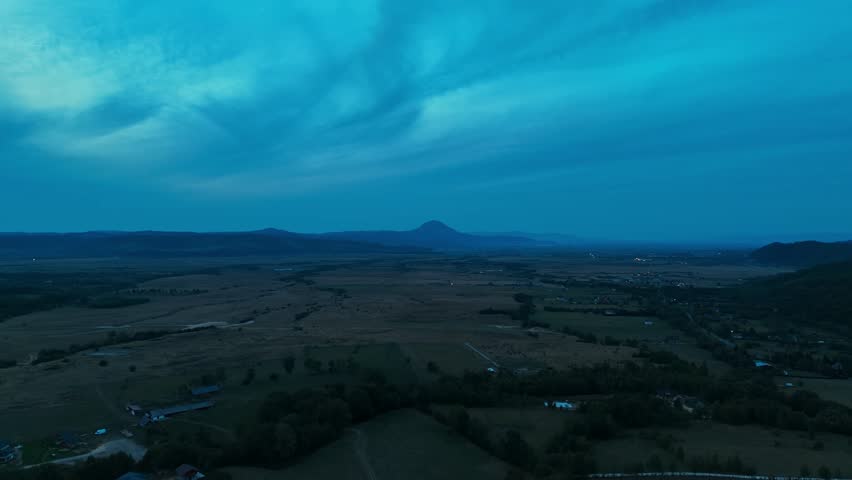 A Serene Landscape at Dusk with Lush Rolling Hills That Captivates the Eye and Soul