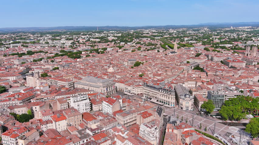 Montpellier, France: Aerial view of French historic city, famous square Place de la Comédie and opera house Opéra Orchestre National, summer day with blue sky - landscape panorama of Europe from above