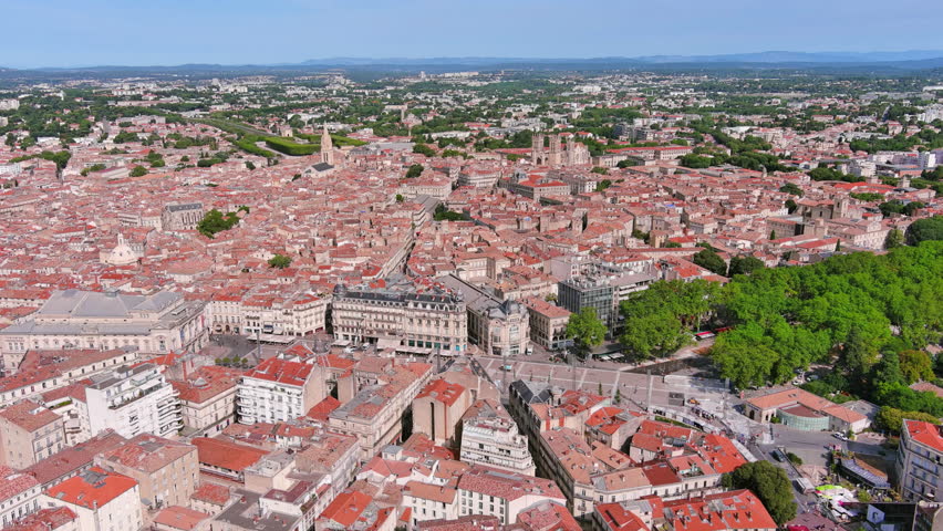 Montpellier, France: Aerial view of French historic city, famous square Place de la Comédie and opera house Opéra Orchestre National, summer day with blue sky - landscape panorama of Europe from above