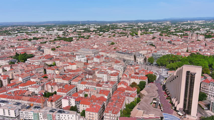 Montpellier, France: Aerial view of French historic city, famous square Place de la Comédie and opera house Opéra Orchestre National, summer day with blue sky - landscape panorama of Europe from above