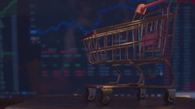 Modern business concept. Stock market. Small shopping cart against the background of a computer monitor with economic indicators. - Powered by Shutterstock - Get 15% off with code: PIKWIZARD15