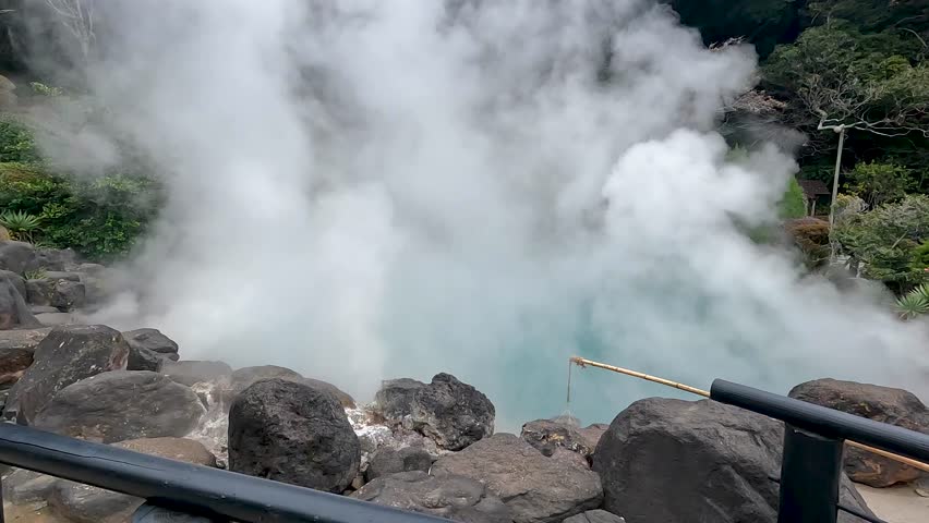 Umi Jigoku is largest among the Beppu Jigoku hot springs. The beautiful cobalt blue color is due to iron sulphate in the hot spring water Beppu Oita Japan - Landscape Travel nature dolly in footage
