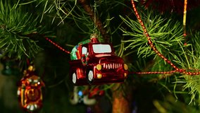 Santa Claus red car with presents. Christmas tree toy decorations. New Year and Merry Christmas. Smooth camera movement on the slider. Video postcard. Live christmas tree with garlands and toys. - Powered by Shutterstock - Get 15% off with code: PIKWIZARD15