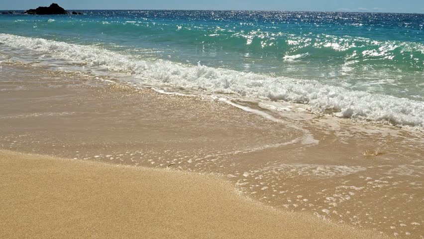 Waves on beach slowmotion, Nosy Be, Nosy Fanihy, Madagaskar, Africa.