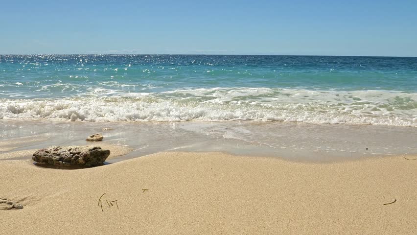 Gentle waves on tropical sandy beach, Nosy Be, Nosy Fanihy, Madagaskar, Africa.