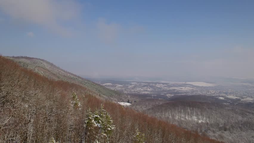 Endless snowy mountain landscape with sweeping views as far as the eye can see.