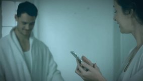 Animation of level up text over caucasian woman using smartphone. Global video game, finance, business, connections, computing and data processing concept digitally generated video. - Powered by Shutterstock - Get 15% off with code: PIKWIZARD15